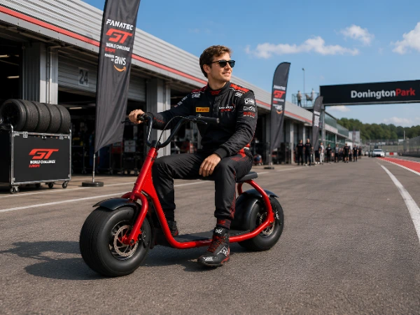 man on scooter at race track, pit lane
Man riding a Pro Scoot electric scooter on a race track pit lane