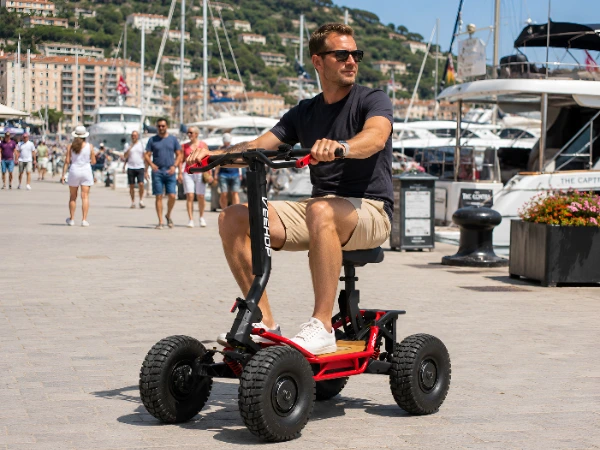 man on scooter at marina/harbour
Man riding a Pro Scoot electric scooter along a marina promenade